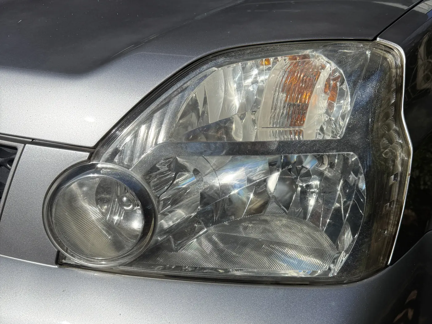 After: the same headlight restored to a clear lens